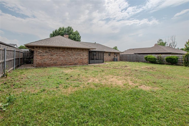5821 NW 89th St, Oklahoma City, OK 73132 - view of yard with central AC