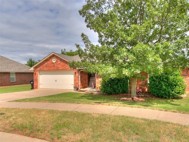 4508 Applegate Dr, Moore, OK 73160 - view of front of property with an attached garage, concrete driveway, brick siding, and a front yard