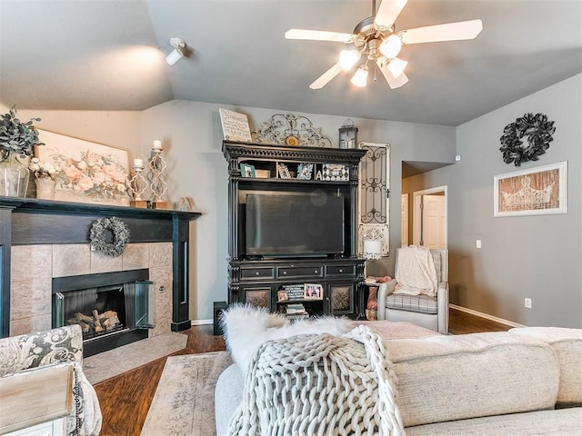 4508 Applegate Dr, Moore, OK 73160 - living area featuring wood finished floors, a ceiling fan, baseboards, lofted ceiling, and a tile fireplace