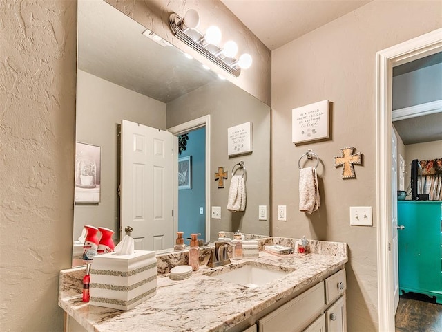 4508 Applegate Dr, Moore, OK 73160 - bathroom with vanity and a textured wall