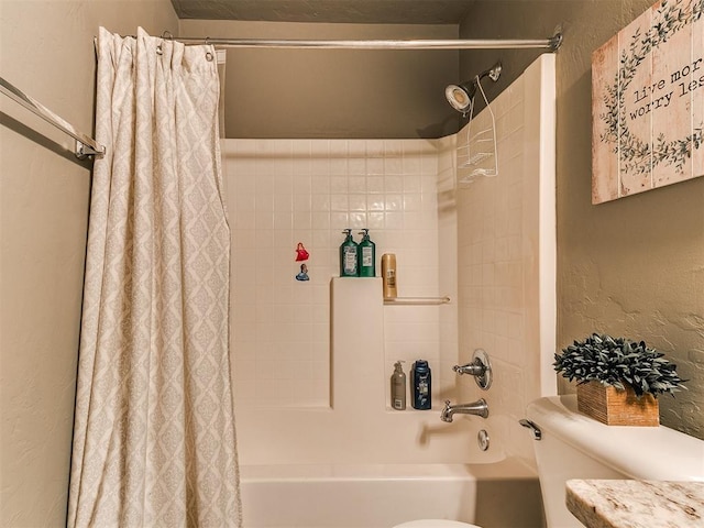 4508 Applegate Dr, Moore, OK 73160 - bathroom featuring toilet, shower / bath combo, and a textured wall