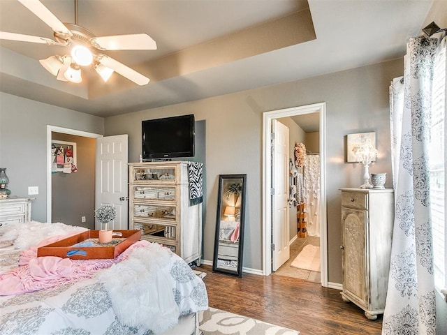 4508 Applegate Dr, Moore, OK 73160 - bedroom with dark wood finished floors, a ceiling fan, and baseboards