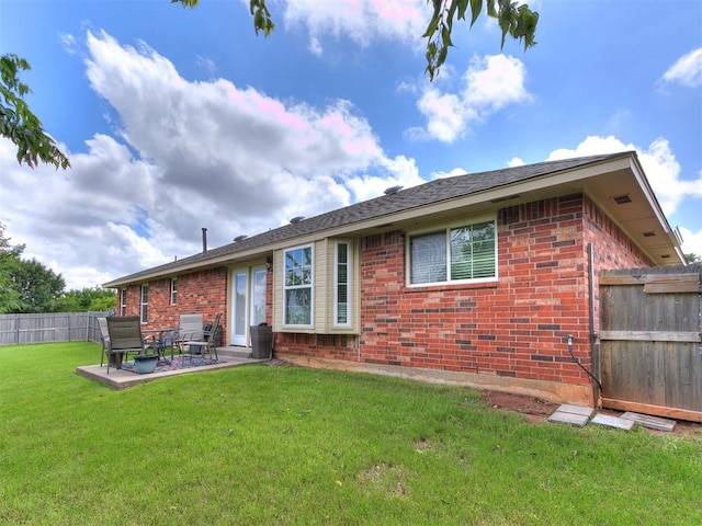 4508 Applegate Dr, Moore, OK 73160 - rear view of house with brick siding and a patio