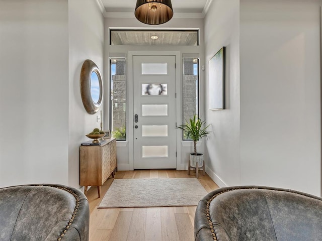 4315 Dusty Trl, Norman, OK 73072 - entrance foyer featuring crown molding, healthy amount of natural light, light wood-style floors, and baseboards