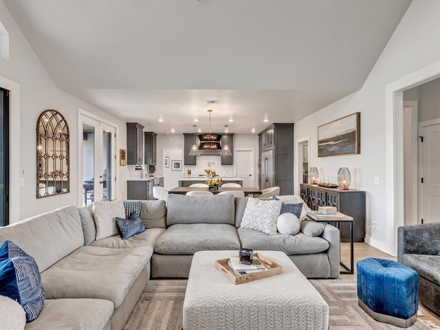 4315 Dusty Trl, Norman, OK 73072 - living area featuring a chandelier, recessed lighting, baseboards, and light wood-style flooring