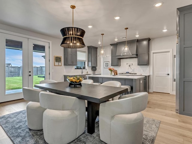 4315 Dusty Trl, Norman, OK 73072 - dining room with light wood finished floors, french doors, and recessed lighting