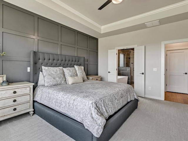 4315 Dusty Trl, Norman, OK 73072 - bedroom featuring ornamental molding, light carpet, a decorative wall, ensuite bath, and a ceiling fan