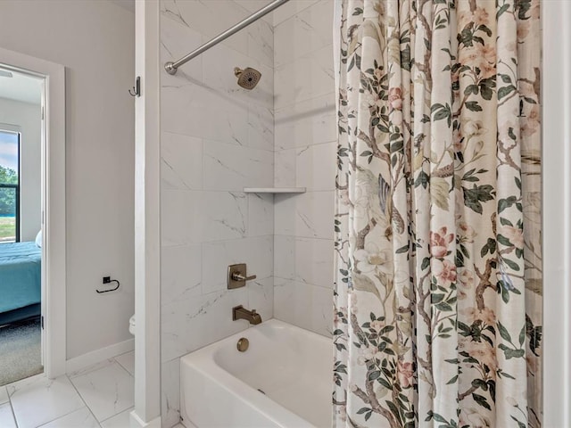 4315 Dusty Trl, Norman, OK 73072 - full bath with marble look tile flooring, shower / bath combo with shower curtain, toilet, baseboards, and ensuite bathroom