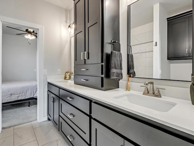 4315 Dusty Trl, Norman, OK 73072 - bathroom featuring double vanity, ceiling fan, marble finish floors, and ensuite bathroom