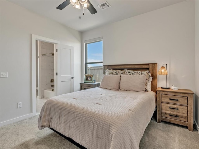 4315 Dusty Trl, Norman, OK 73072 - bedroom with carpet, baseboards, ensuite bath, and a ceiling fan