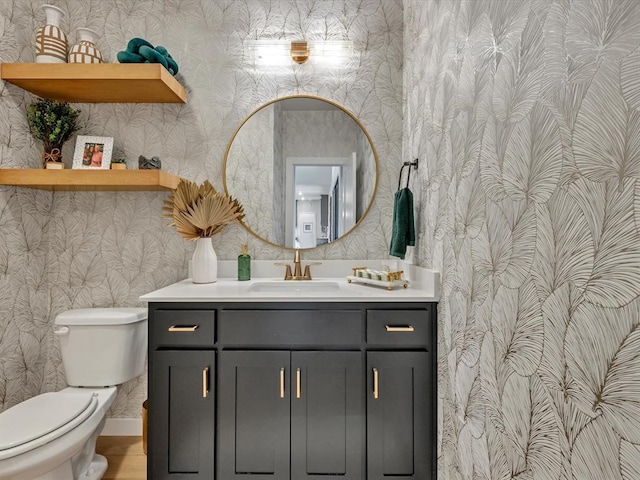 4315 Dusty Trl, Norman, OK 73072 - bathroom featuring wallpapered walls, toilet, and vanity