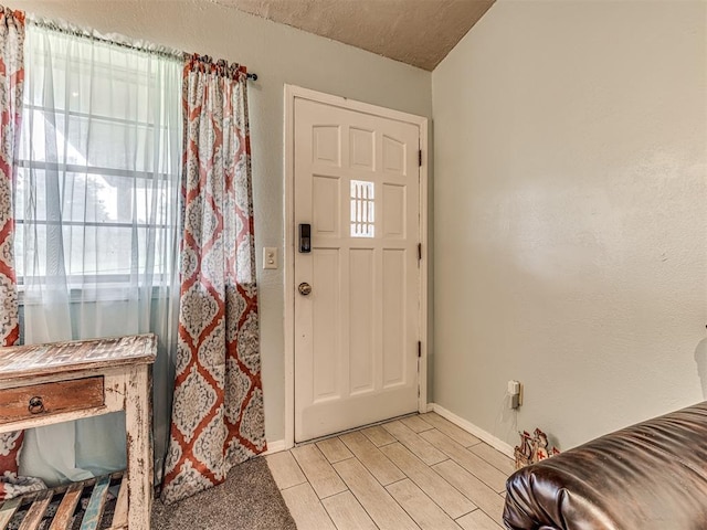 11379 Kirkwin Ln, Choctaw, OK 73020 - entryway featuring baseboards and wood tiled floors