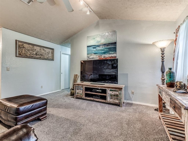 11379 Kirkwin Ln, Choctaw, OK 73020 - living area with baseboards, carpet flooring, track lighting, vaulted ceiling, and ceiling fan