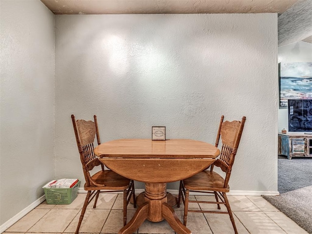 11379 Kirkwin Ln, Choctaw, OK 73020 - dining room with baseboards, a textured wall, and light tile patterned floors