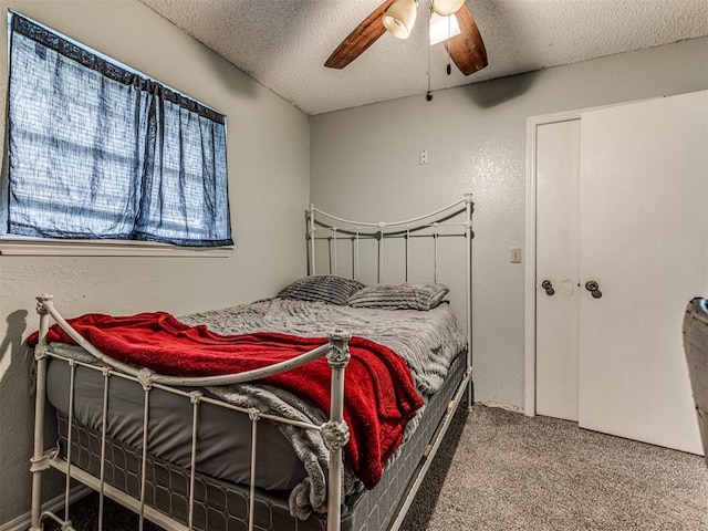 11379 Kirkwin Ln, Choctaw, OK 73020 - carpeted bedroom with a textured ceiling and ceiling fan