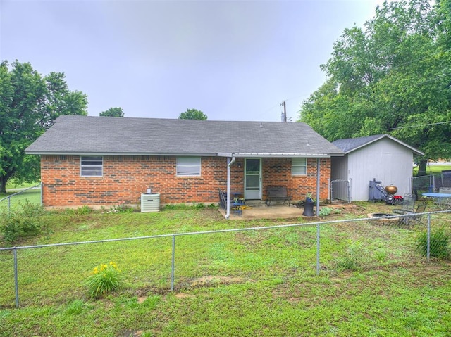 11379 Kirkwin Ln, Choctaw, OK 73020 - view of front of home featuring central AC unit, brick siding, a shingled roof, and a patio