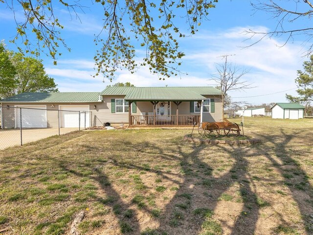 35345 Ew 1240th Rd, Seminole, OK 74868 - ranch-style house with concrete driveway, a porch, metal roof, and a garage