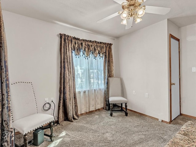 35345 Ew 1240th Rd, Seminole, OK 74868 - sitting room with carpet floors, ceiling fan, and baseboards