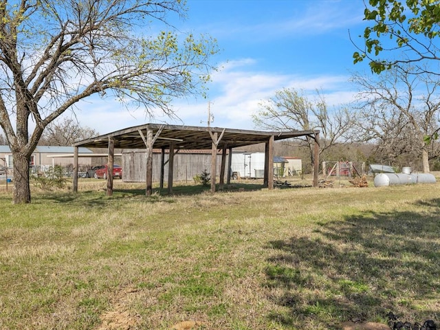 35345 Ew 1240th Rd, Seminole, OK 74868 - view of green lawn featuring an outbuilding, a pole building, and a detached carport