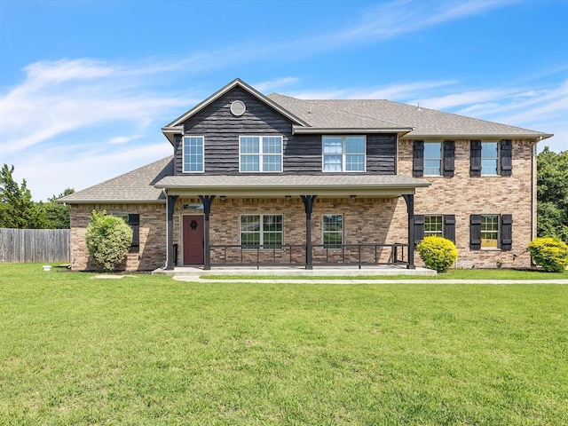 10740 Starboard Way, Edmond, OK 73025 - view of front of home featuring a porch, brick siding, and a shingled roof