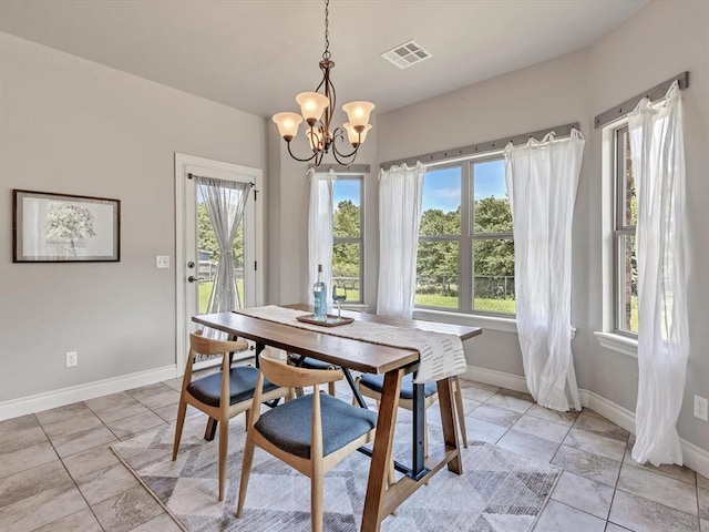 10740 Starboard Way, Edmond, OK 73025 - dining room with a chandelier and healthy amount of natural light