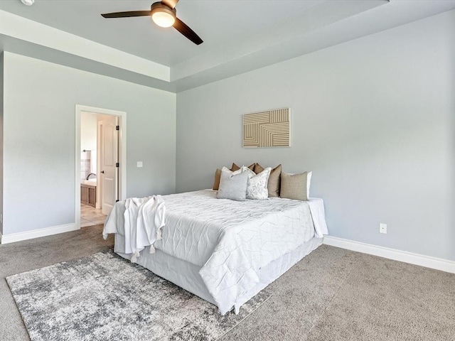 10740 Starboard Way, Edmond, OK 73025 - carpeted bedroom featuring ensuite bathroom and a ceiling fan