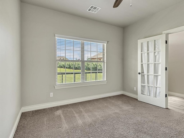 10740 Starboard Way, Edmond, OK 73025 - spare room featuring carpet and a ceiling fan