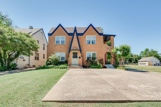 1502 NW 39th St, Oklahoma City, OK 73118 - townhome / multi-family property with a front yard and brick siding