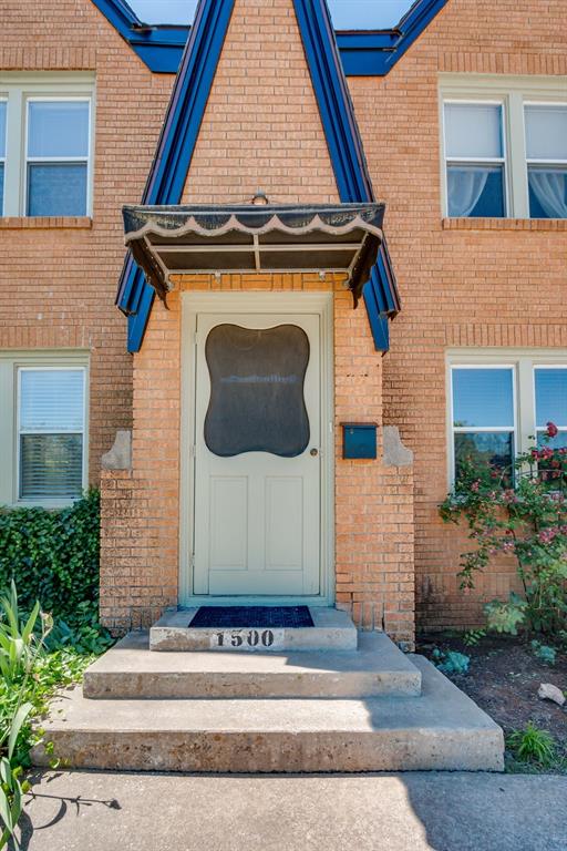 1502 NW 39th St, Oklahoma City, OK 73118 - view of exterior entry featuring brick siding