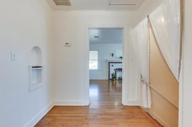 1502 NW 39th St, Oklahoma City, OK 73118 - corridor featuring light wood-type flooring, crown molding, and baseboards