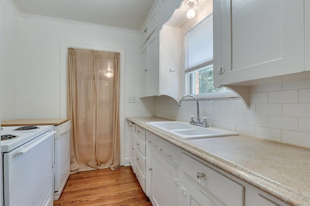 1502 NW 39th St, Oklahoma City, OK 73118 - kitchen with a sink, white electric range oven, white cabinets, tasteful backsplash, and light countertops