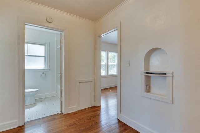 1502 NW 39th St, Oklahoma City, OK 73118 - hall with ornamental molding, wood finished floors, and baseboards