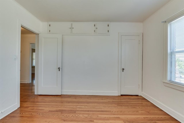 1502 NW 39th St, Oklahoma City, OK 73118 - unfurnished bedroom featuring light wood finished floors, a closet, and baseboards