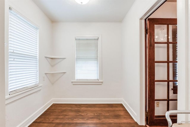 1502 NW 39th St, Oklahoma City, OK 73118 - empty room with crown molding, dark wood-style flooring, plenty of natural light, and baseboards