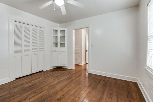 1502 NW 39th St, Oklahoma City, OK 73118 - unfurnished bedroom featuring dark wood-style floors, baseboards, a closet, and ceiling fan