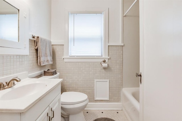 1502 NW 39th St, Oklahoma City, OK 73118 - bathroom featuring vanity, tile walls, tile patterned flooring, and toilet