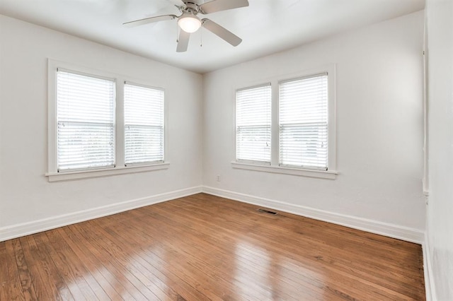 1502 NW 39th St, Oklahoma City, OK 73118 - spare room featuring plenty of natural light, wood-type flooring, baseboards, and a ceiling fan