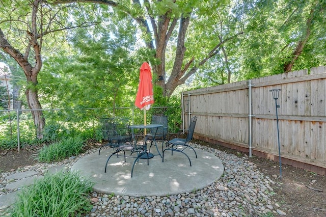 1502 NW 39th St, Oklahoma City, OK 73118 - fenced backyard featuring a patio and outdoor dining space