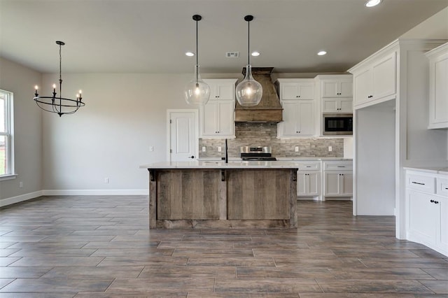 10412 SW 49th St, Mustang, OK 73064 - kitchen featuring appliances with stainless steel finishes, a chandelier, tasteful backsplash, white cabinetry, and recessed lighting