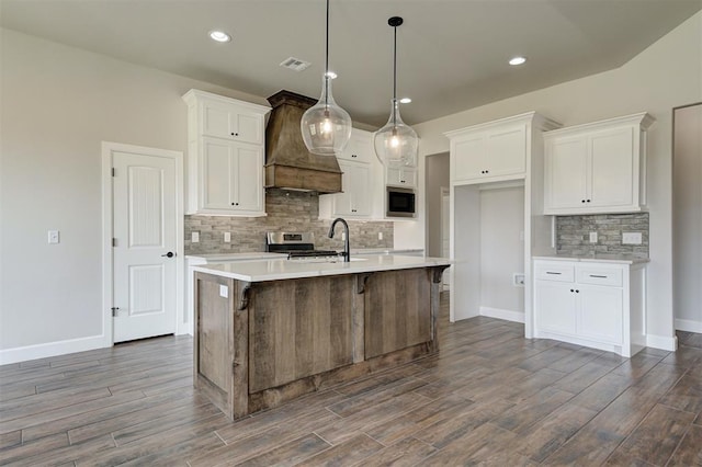 10412 SW 49th St, Mustang, OK 73064 - kitchen with built in microwave, custom exhaust hood, stainless steel range, dark wood-type flooring, and recessed lighting