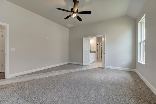 10412 SW 49th St, Mustang, OK 73064 - unfurnished bedroom with light carpet, lofted ceiling, baseboards, a ceiling fan, and ensuite bathroom