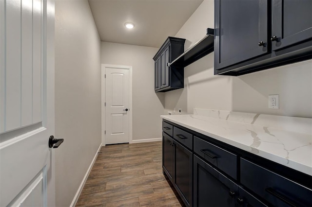 10412 SW 49th St, Mustang, OK 73064 - laundry room with cabinet space, baseboards, dark wood-style floors, and recessed lighting