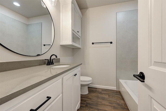 10412 SW 49th St, Mustang, OK 73064 - full bath with vanity, toilet, wood finished floors, baseboards, and recessed lighting
