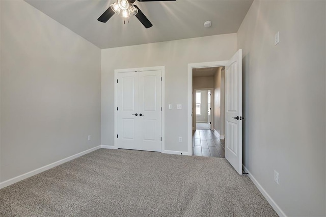 10412 SW 49th St, Mustang, OK 73064 - unfurnished bedroom with carpet floors, baseboards, a closet, and ceiling fan