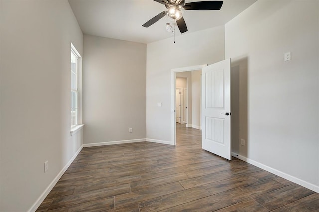 10412 SW 49th St, Mustang, OK 73064 - unfurnished room featuring ceiling fan, dark wood finished floors, and baseboards