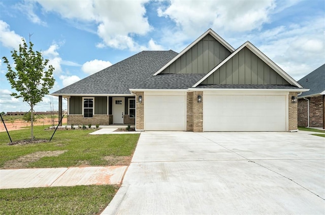 10421 SW 50th St, Mustang, OK 73064 - craftsman-style house with board and batten siding, brick siding, and an attached garage