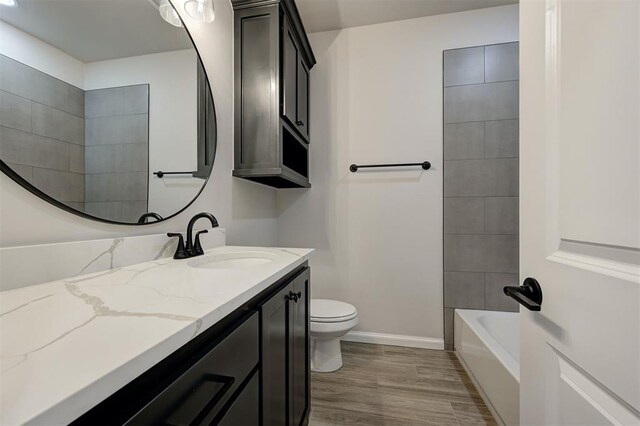 10421 SW 50th St, Mustang, OK 73064 - bathroom featuring vanity and wood finished floors