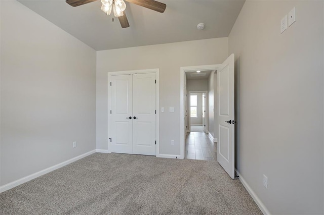 10421 SW 50th St, Mustang, OK 73064 - unfurnished bedroom featuring carpet floors, a closet, and ceiling fan
