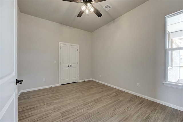 10421 SW 50th St, Mustang, OK 73064 - spare room featuring ceiling fan and light wood-type flooring