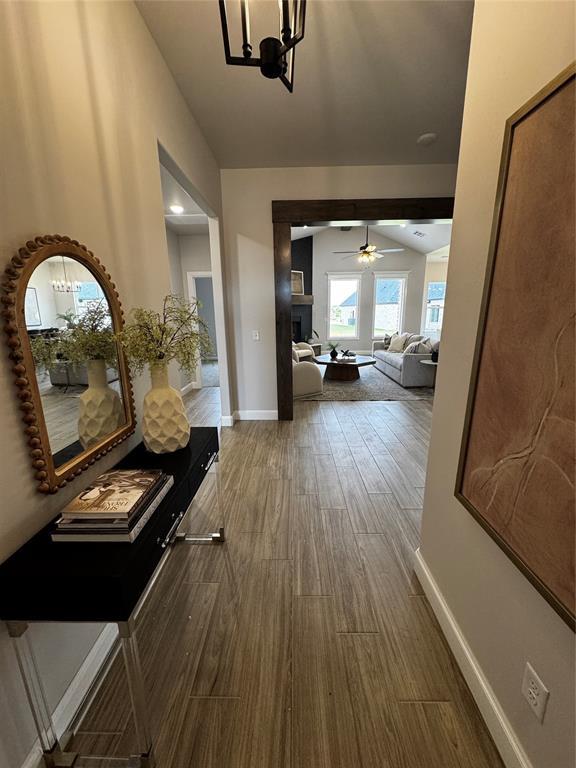 10421 SW 50th St, Mustang, OK 73064 - corridor featuring dark wood-style flooring and baseboards